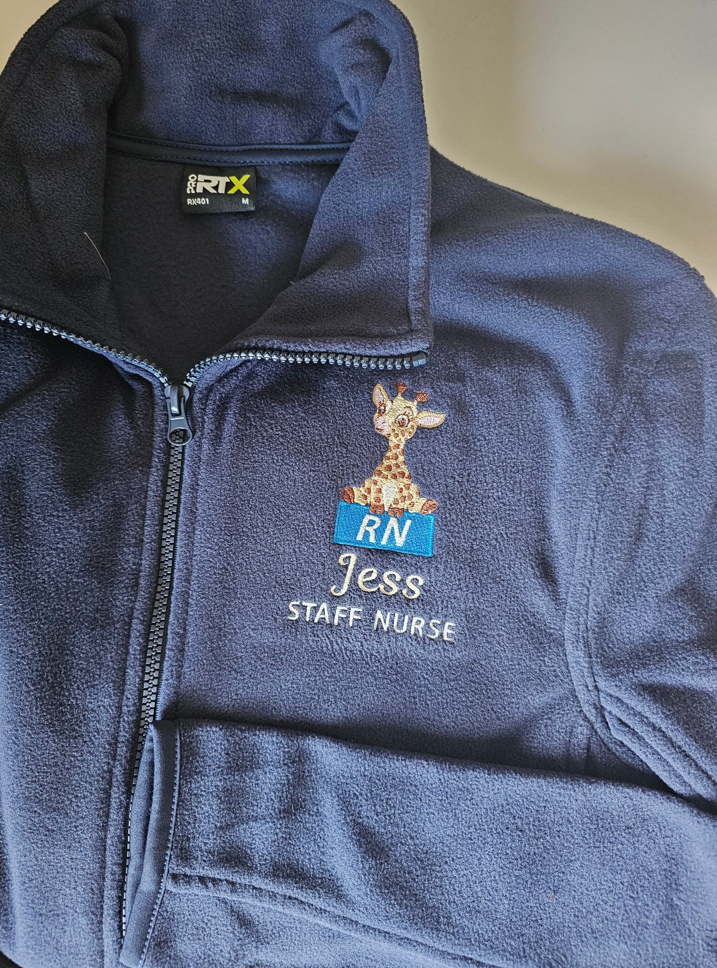 Embroidered giraffe fleece with blue logo for initials fleece, NICU nurse, midwife fleece, student midwife jacket, student nurse fleece, doctor fleece